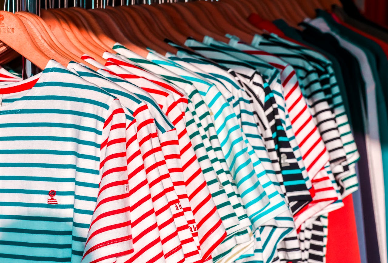 mobile-01 Colorful striped shirts hanging in a store in Arzon, Bretagne, France