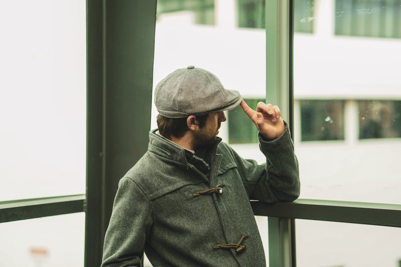 creative-03 stylish-adult-male-in-gray-winter-outfit-looking-outdoors-33365332